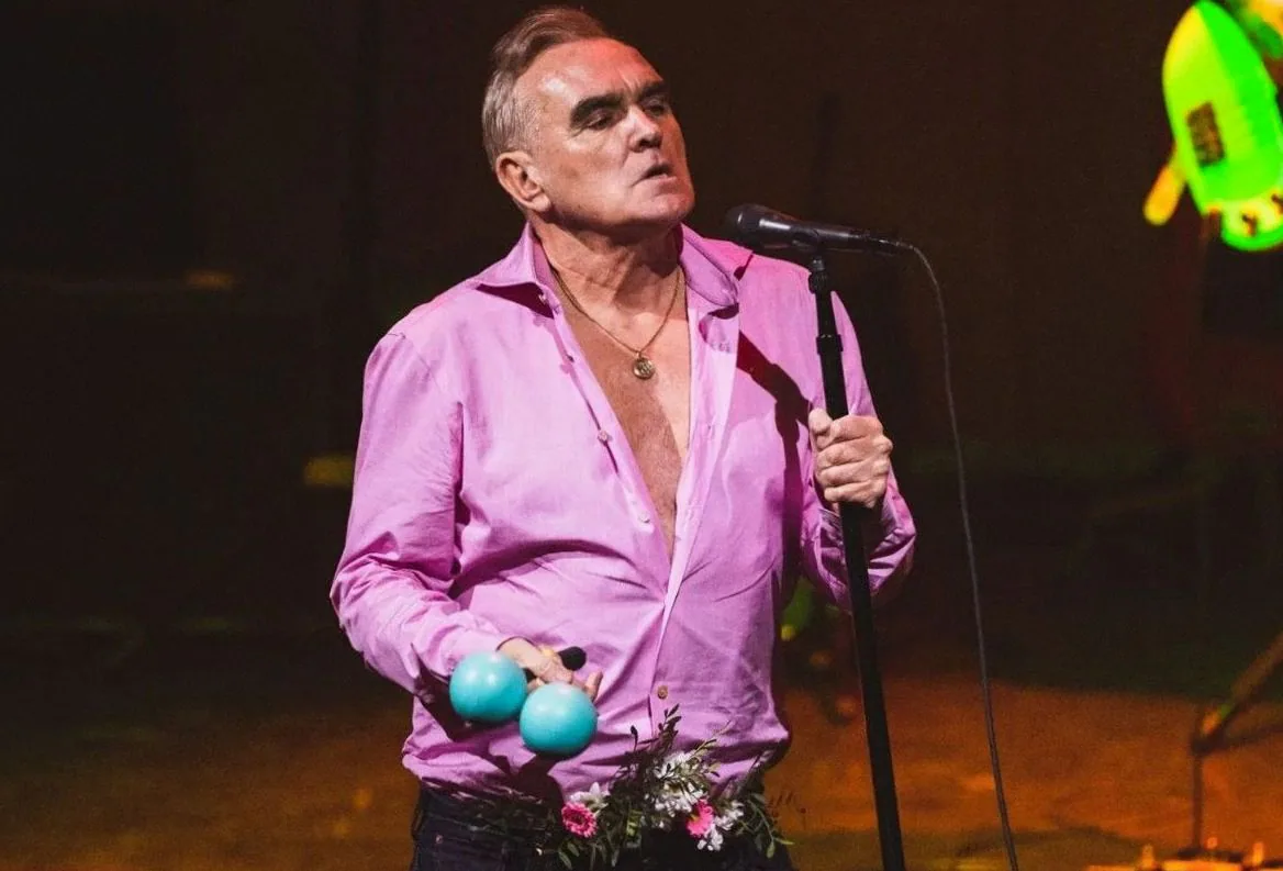 Morrissey is selling The Smiths merchandise with his name on it instead of the band's